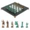 Шахматы "Римские воины" фигуры бронза / патина 28х28 см из мрамора и змеевика